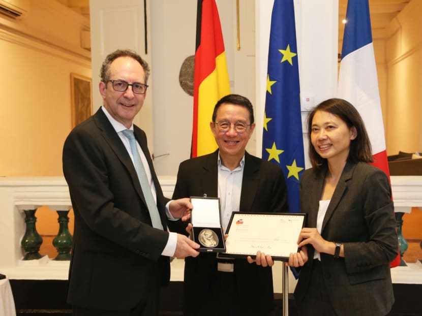 Mr Alex Au receiving the Franco-German Human Rights and Rule of Law Prize from Germany's ambassador to Singapore Dr Norbert Riedel (left), and France's ambassador to Singapore, Ms Minh-di Tang on Jan 13, 2023. Mr Alex Au receiving the Franco-German Human Rights and Rule of Law Prize from Germany's ambassador to Singapore Dr Norbert Riedel (left), and France's ambassador to Singapore, Ms Minh-di Tang on Jan 13, 2023.