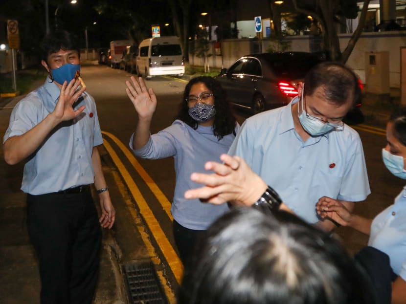 From left: Dr Jamus Lim, Ms Raeesah Khan and Mr Chua Kheng Wee thanking party volunteers after leaving the Workers’ Party headquarters in Geylang on July 11, 2020.