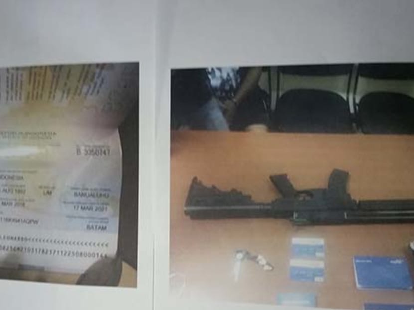 Passport of suspect arrested, and items seized during last Saturday's raid. Photo: Riau Police