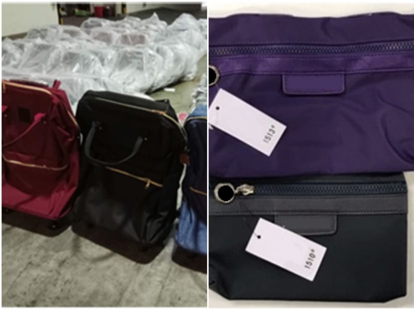A total of 318 counterfeit bags with an estimated street value of S$11,680 were seized after officers conducted raids at a warehouse and residential unit. Photo: Singapore Police Force