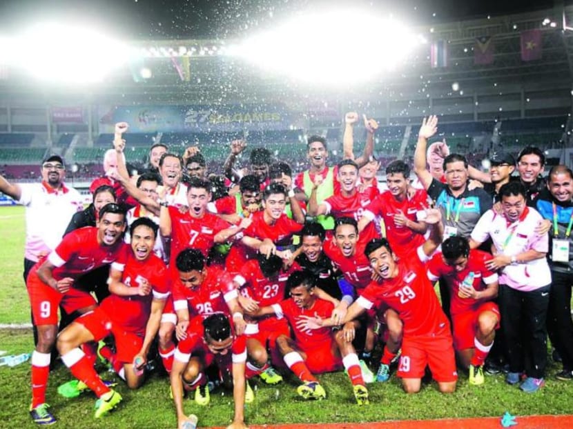Singapore's Under-23 team celebrating winning the bronze medal at the 2013 SEA Games in Myanmar.