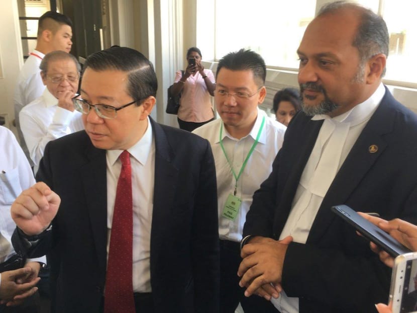 Penang Chief Minister Lim Guan Eng (L) and his lawyer Gobind Singh Deo (R), at the Penang High Court on Monday for the first day of the corruption trial over Lim's bungalow purchase. Photo: The Malaysian Insight