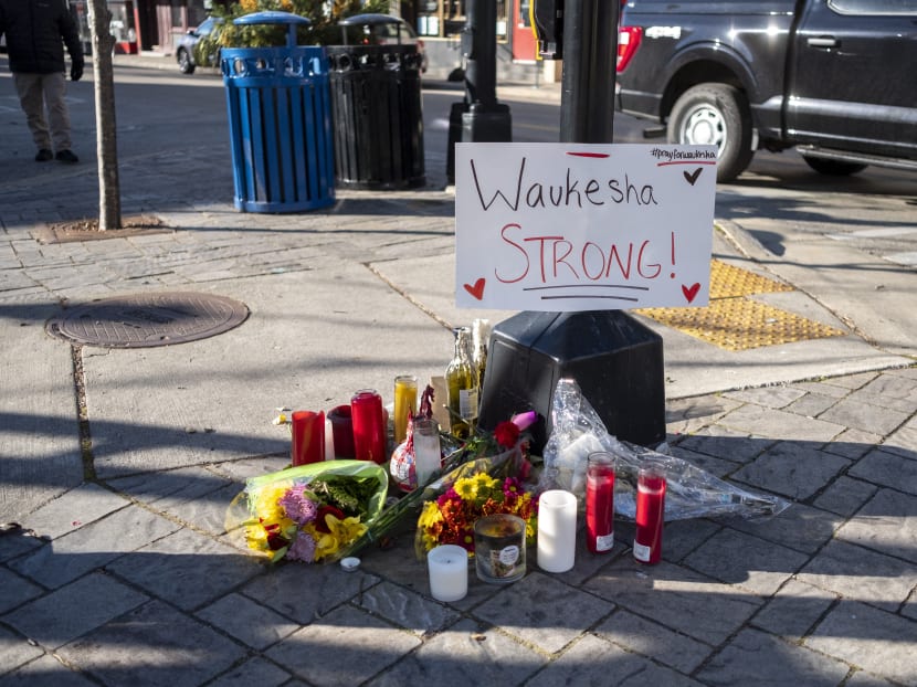 Memorials placed along Main Street in downtown Waukesha Wisconsin where people were hit by a driver plowing into the Christmas parade on Nov 22, 2021.