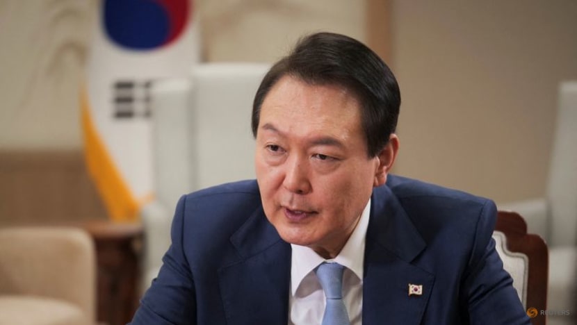 South Korea bank shares slide amid political push to share profit