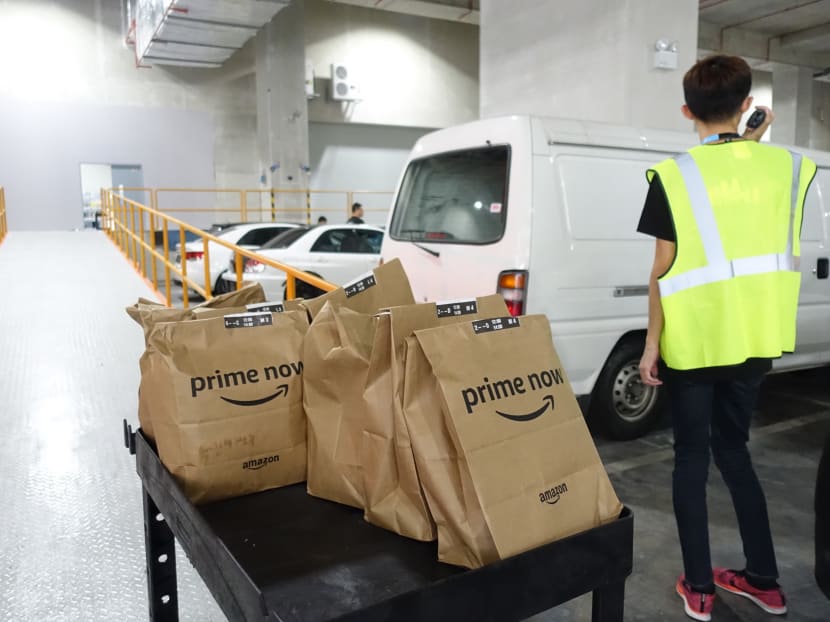 Queue of cars and van seen waiting to receive the Amazon's Prime Now orders at the loading bay on 27 July 2017, taken during the Launch of Amazon Prime Now, its speedy two-hour delivery service in Singapore . Photo: Koh Mui Fong/TODAY Queue of cars and van seen waiting to receive the Amazon's Prime Now orders at the loading bay on 27 July 2017, taken during the Launch of Amazon Prime Now, its speedy two-hour delivery service in Singapore . Photo: Koh Mui Fong/TODAY