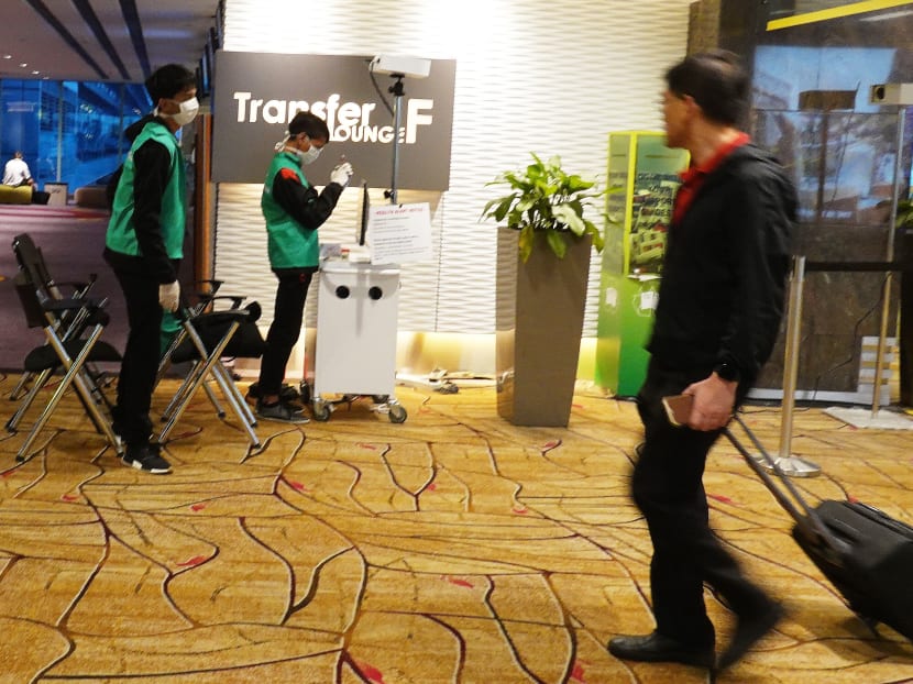 The body temperature of travellers are displayed on a monitor at one of several scanning posts in Changi Airport during the Covid-19 outbreak.