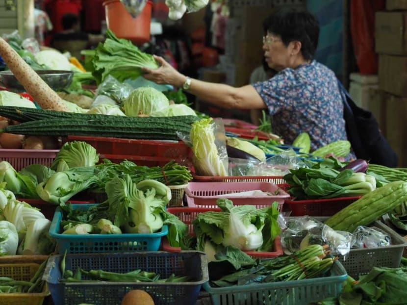Vegetable stalls at the Chong Pang City Wet Market. Wholesale prices of vegetables have risen up to 80 per cent due to floods in Malaysia.