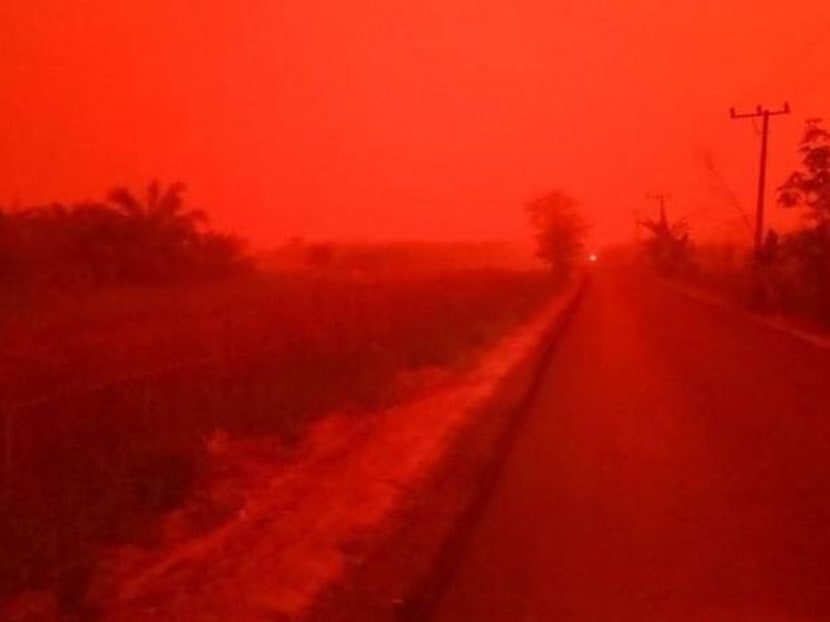 The red skies emerged against the backdrop of a worsening haze situation caused by forest fires in Indonesia. Central Sumatra, where Jambi is located, is home to many haze hot spots. The red skies emerged against the backdrop of a worsening haze situation caused by forest fires in Indonesia. Central Sumatra, where Jambi is located, is home to many haze hot spots.