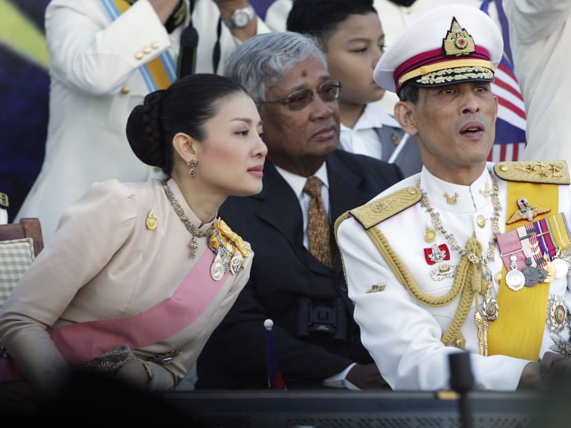 Thailand's Crown Price Maha Vajiralongkorn (right) chats with his royal consort Princess Srirasm as they watch a parade at the historic Merdeka square in downtown Kuala Lumpur, Aug 31, 2007. Photo: AP