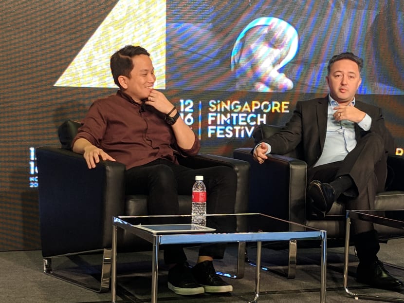 Mr Andre Soelistyo (L), Go-Jek's president, speaks during a fireside chat moderated by Mr Solmaz Altin (R), deputy regional chief executive officer (Asia Pacific) of Allianz, during the Singapore Fintech Festival on Nov 14, 2018.
