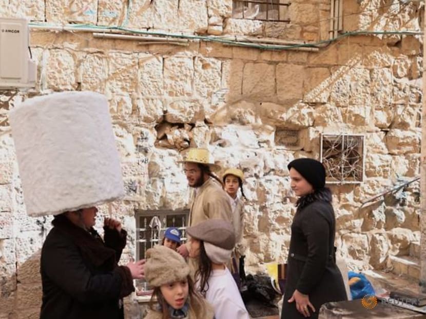 COVID curbs dampen carousing on Jewish costume festival Purim COVID curbs dampen carousing on Jewish costume festival Purim