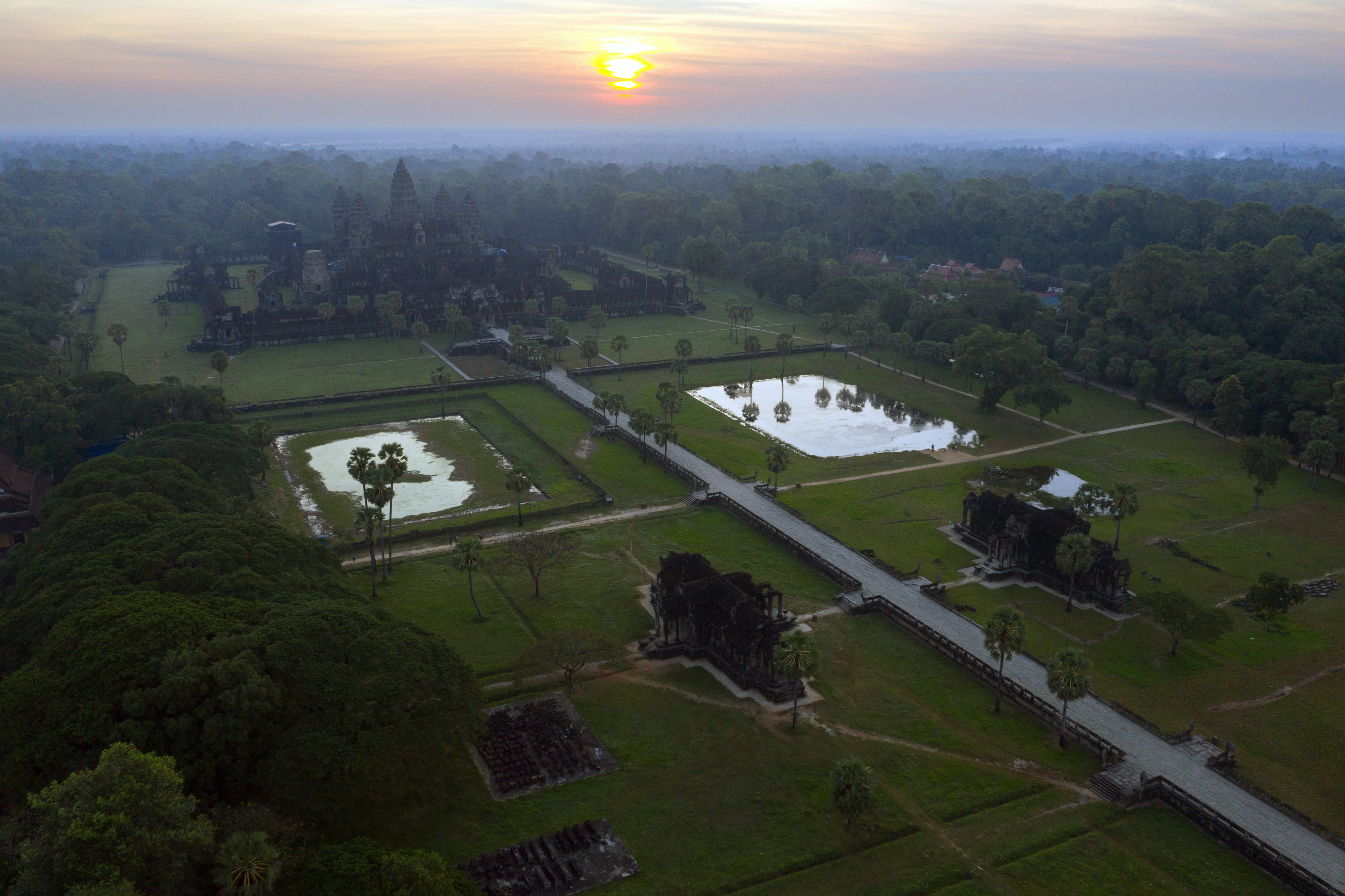 An aerial view of the ancient temple complex of Angkor Wat in Siem Reap, Cambodia at sunrise on Dec 7, 2021. Cambodia has been open to foreign tourists for months, but in this time of Covid-19, few have made the trip. An aerial view of the ancient temple complex of Angkor Wat in Siem Reap, Cambodia at sunrise on Dec 7, 2021. Cambodia has been open to foreign tourists for months, but in this time of Covid-19, few have made the trip.