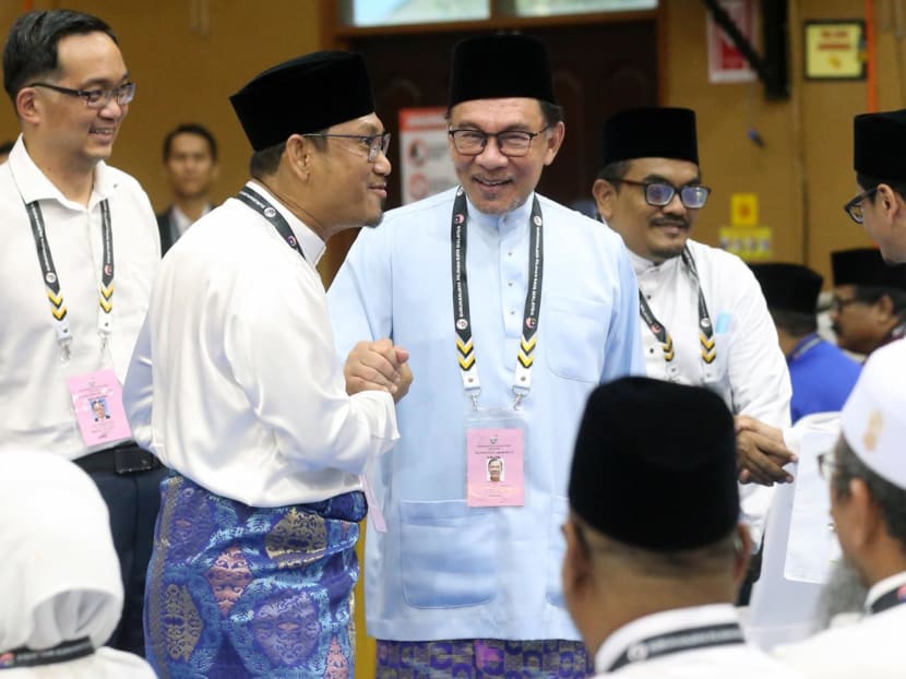 (Centre) Anwar Ibrahim, Chairman of the Pakatan Harapan (PH) coalition and Parti Keadilan Rakyat (PKR) president greeting Perikatan Nasional's (PN) candidate Ahmad Faizal Azumu at the Nomination Centre in Tambun, Perak on Nov 5, 2022. 
