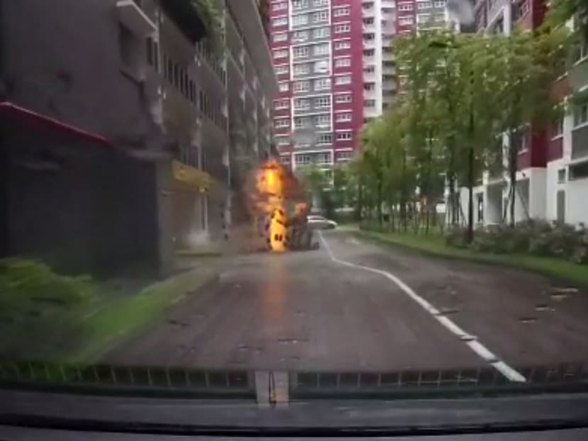 A manhole blows up outside a multi-storey car park at Bukit Batok West. This screengrab was taken from a dashcam video circulating on social media.