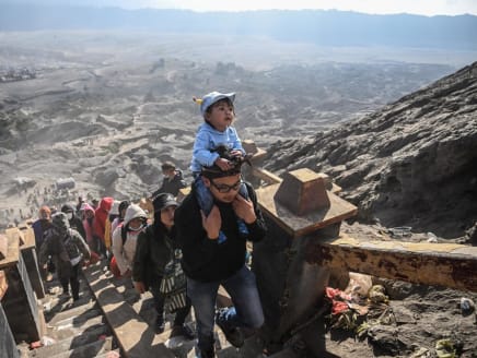 Members of the Tengger sub-ethnic group ascend the active Mount Bromo volcano to present offerings of rice, fruit, livestock and other items as part of the Yadnya Kasada festival in Probolinggo, East Java province on June 5, 2023.