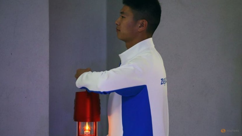 Beijing lights flame, to be first city to host summer, winter games Beijing lights flame, to be first city to host summer, winter games