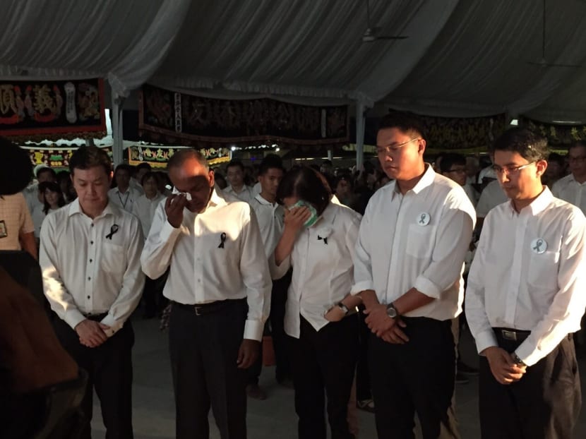 Foreign Affairs Minister K Shanmugam and other ministers tear up at the Nee Soon GRC community tribute site. Photo: Valerie Koh