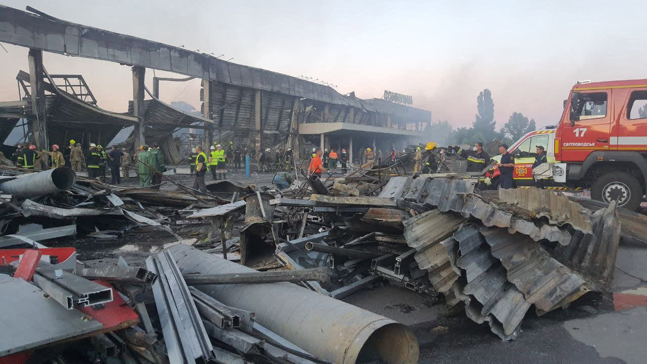 Handout picture taken and released by the Ukraine's State Emergency Service on June 27, 2022 shows rescuers working in a mall hit by a Russian missile strike in the eastern Ukrainian city of Kremenchuk. Handout picture taken and released by the Ukraine's State Emergency Service on June 27, 2022 shows rescuers working in a mall hit by a Russian missile strike in the eastern Ukrainian city of Kremenchuk.