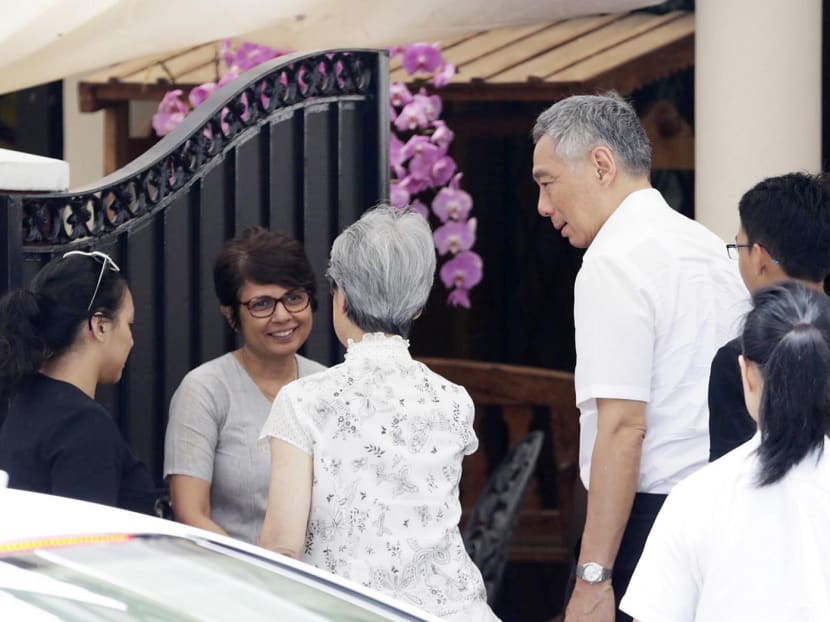 PM Lee and his wife, Mdm Ho Ching, speaking with Mr Nathan’s daughter, Juthika Ramanathan, at the private wake yesterday. Photo: Wee Teck Hian