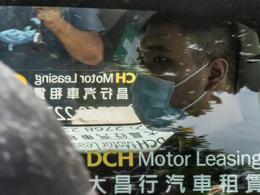 Tong Ying-kit, who is accused of deliberately driving his motorcycle into a group of police officers on July 1, arrives at the West Kowloon court in Hong Kong on July 6, 2020.