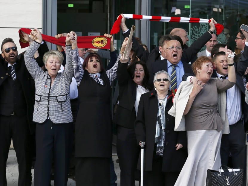 Relatives sing You'll Never Walk Alone  after the jury delivered its verdict at the new inquests into the Hillsborough disaster, in Warrington, Britain April 26, 2016. Photo: Reuters
