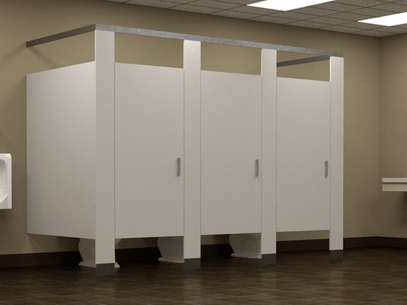 A view of restroom stalls in a stock photo.