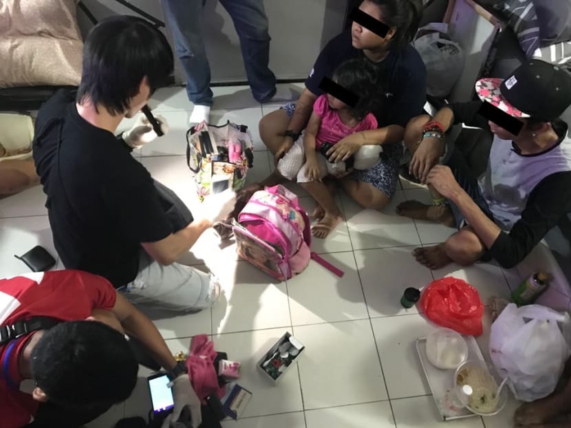 CNB officers conducting a search at a unit in Chin Swee Road on June 5, 2018. A four-year-old child was in the unit with the mother, a 22-year-old suspected drug abuser.