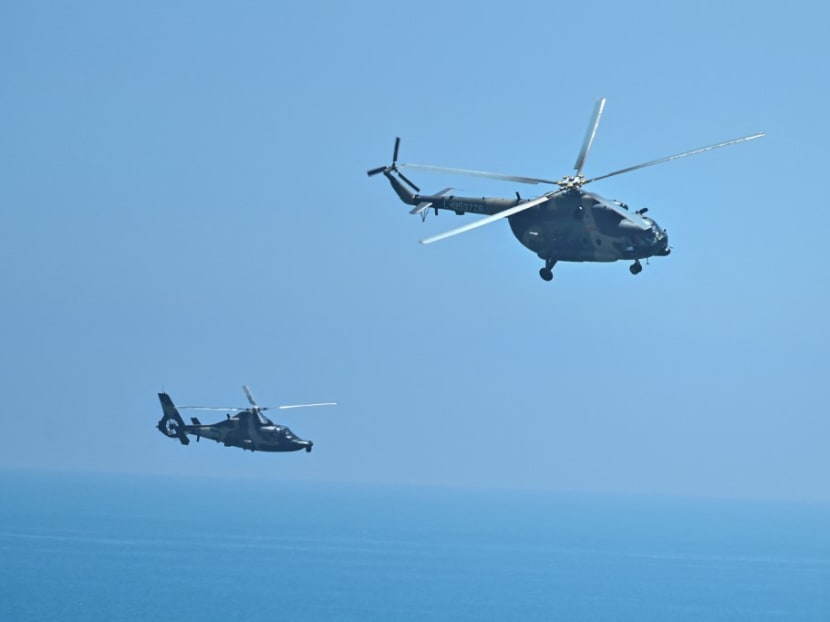 Chinese military helicopters fly past Pingtan island, one of mainland China's closest point from Taiwan, in Fujian province on Aug 4, 2022, ahead of massive military drills off Taiwan following US House Speaker Nancy Pelosi's visit to the self-ruled island. 