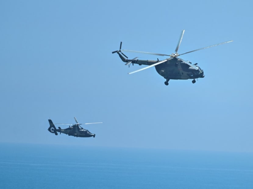 Chinese military helicopters fly past Pingtan island, one of mainland China's closest point from Taiwan, in Fujian province on Aug 4, 2022, ahead of massive military drills off Taiwan following US House Speaker Nancy Pelosi's visit to the self-ruled island. Chinese military helicopters fly past Pingtan island, one of mainland China's closest point from Taiwan, in Fujian province on Aug 4, 2022, ahead of massive military drills off Taiwan following US House Speaker Nancy Pelosi's visit to the self-ruled island.