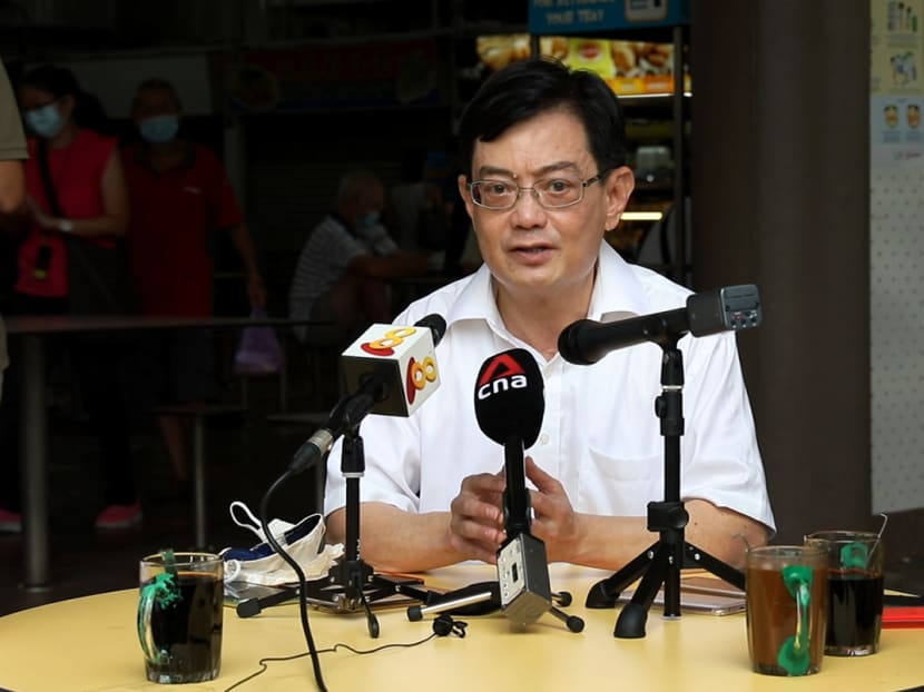 Mr Heng Swee Keat speaking to the media during a walkabout at Teban Market and Food Centre on June 27, 2020.