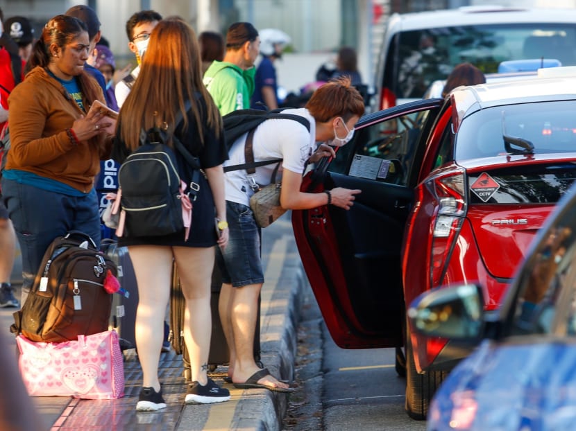 Commuters entering Singapore via the Woodlands Checkpoint on March 17, 2020. Malaysia begins a 14-day lockdown starting March 18.