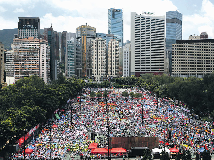 Thousands of people gathering yesterday at Hong Kong’s Victoria Park to protest against the pro-democracy Occupy Central movement. Photo: AP