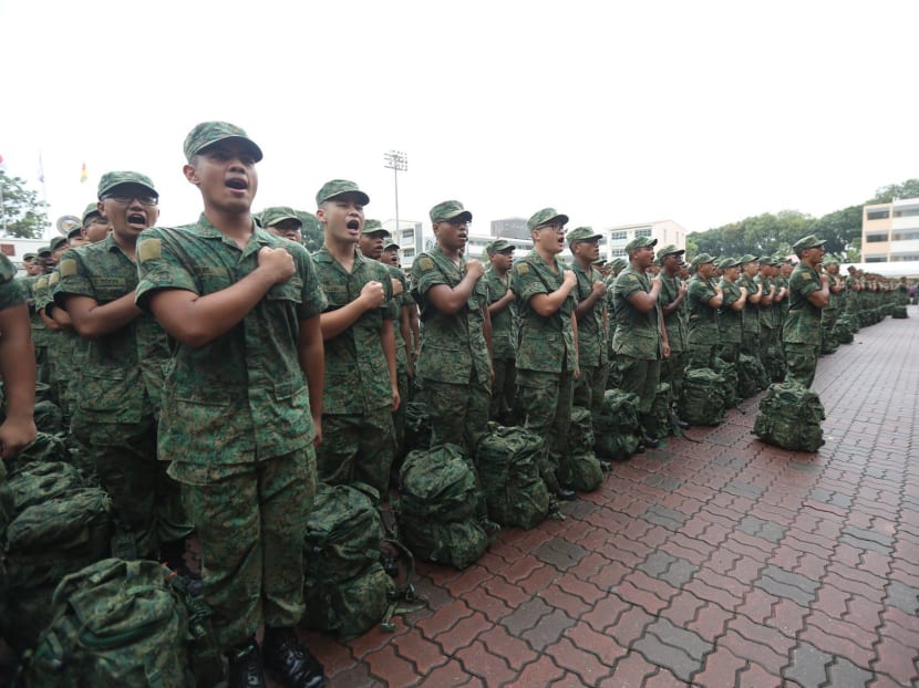 Recruits reciting the SAF pledge at a passing out parade in March 2018. Defending the need for NS will invariably be challenging in peace because its need may not be obviously apparent, says the author. Photo: Facebook / The Singapore Army