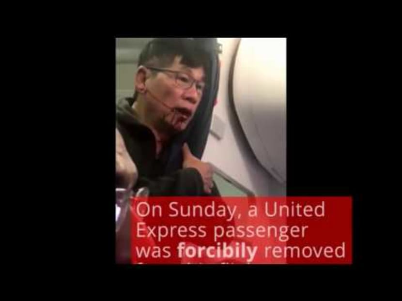 United Express passenger hauled off overbooked flight
