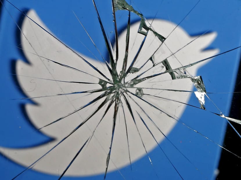 A 3D-printed Twitter logo is seen through broken glass, in this picture illustration taken February 8, 2016. Photo illustration: Reuters