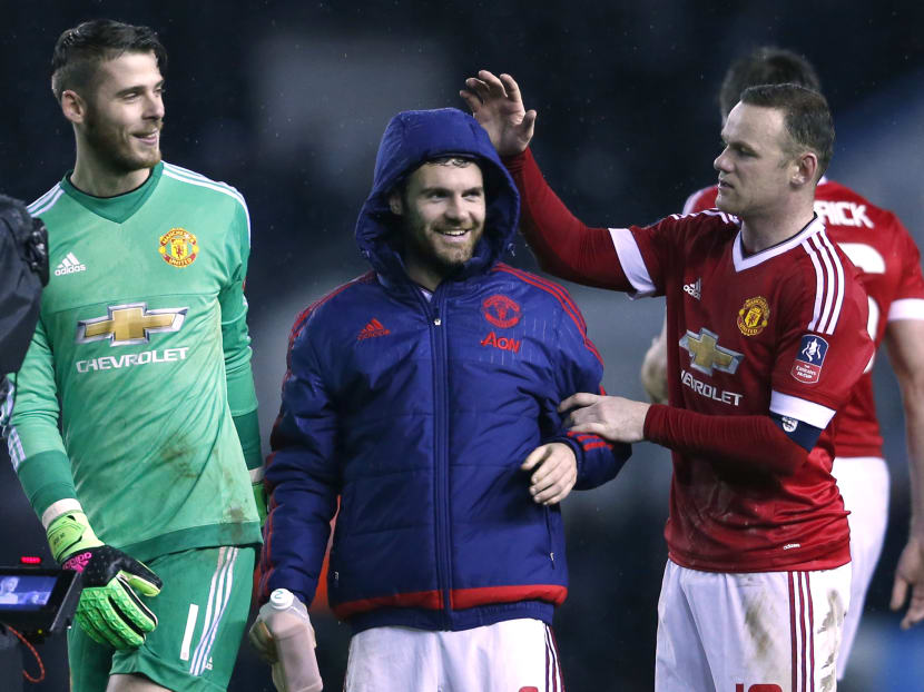 Juan Mata, David de Gea and Wayne Rooney celebrate at the end of the match. Photo: Reuters