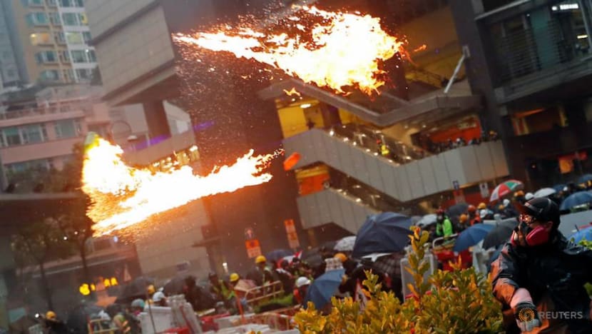 Hong Kong police say violent protesters forced use of water cannon, warning shot Hong Kong police say violent protesters forced use of water cannon, warning shot