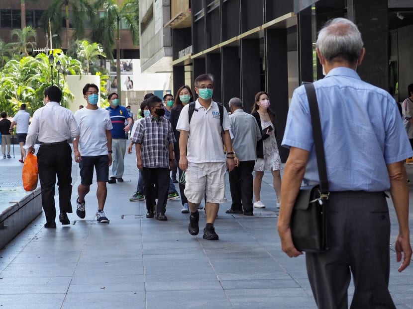 Office workers in Singapore's central business district. There is no consistent evidence that suggests older workers are less productive than younger workers, says the author.