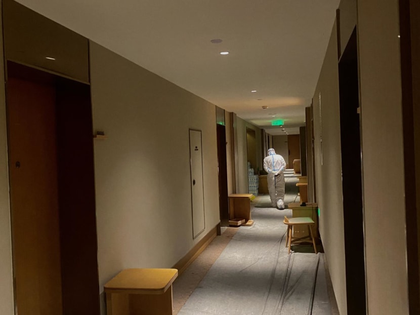 Photo taken on June 17, 2022 showing a hotel staff member walking down the hallway of a quarantine-designated hotel in Shanghai.