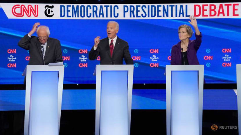 Democrats go on attack against Warren on healthcare, taxes at presidential debate