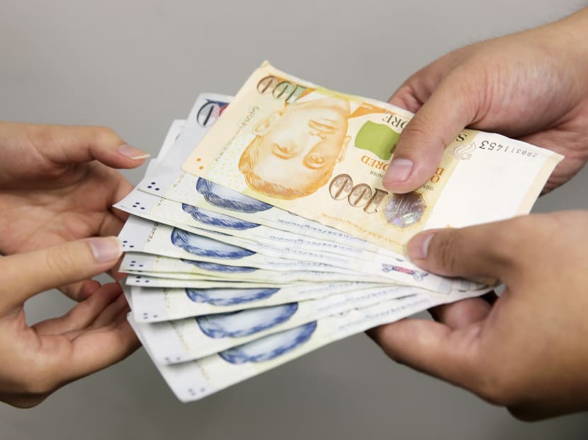 A cap on moneylenders' interest rates will soon go from 20 per cent for borrowers earning below S$30,000 annually to four per cent per month for all borrowers. TODAY file photo