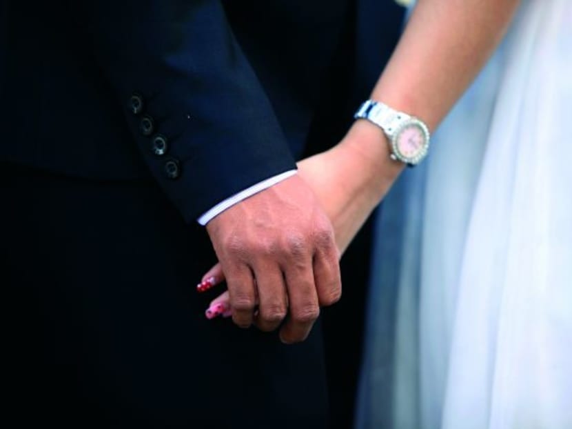 When it comes to things like marriages in the family, Singaporeans still prefer someone of the same race. PHOTO: Reuters