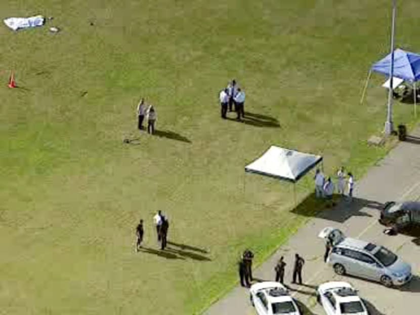 In this image taken from video and provided by WABC-TV in New York, investigators stand near a remote controlled toy helicopter, center, that apparently struck and killed a 19-year-old man, top left, Thursday, Sept. 5, 2013, at Calvert Vaux Park in the Brooklyn borough of New York. Photo: AP