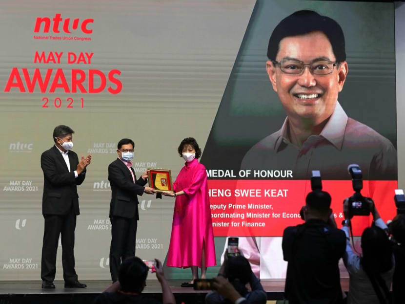 DPM Heng Swee Keat conferred the Medal of Honour at the NTUC May Day Awards 2021 ceremony on April 28, 2021. Presenting the award was NTUC president Mary Liew and NTUC secretary-general Ng Chee Meng.