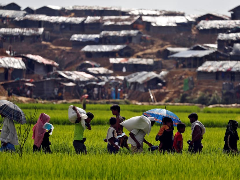 Rohingya on their way to a refugee camp in Bangladesh on Sunday. The current situation could lead to spillover effects to special economic zones where Thailand, Japan and China have invested billions. Photo: Reuters