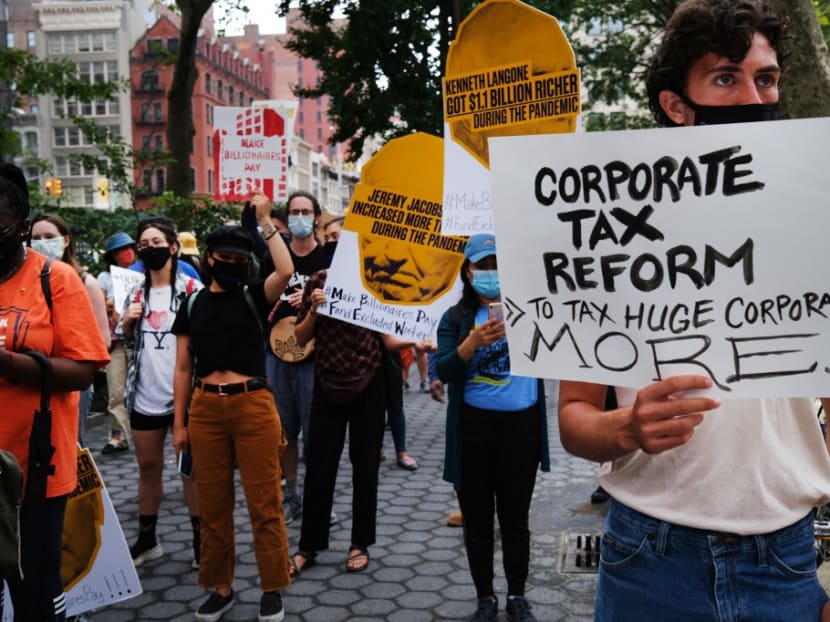 People participate in a "March on Billionaires" event on July 17, 2020 in New York City.