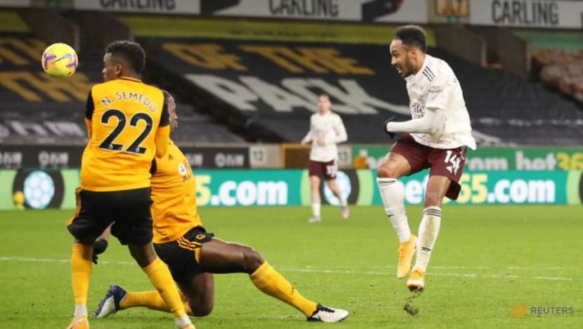 Football: Nine-man Arsenal self-destruct in defeat at Wolves
