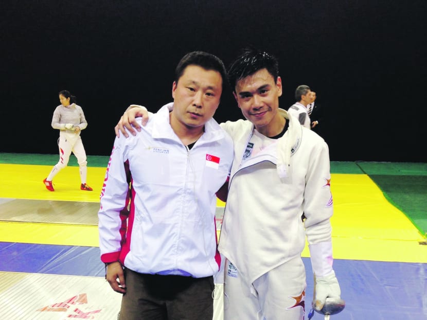 Epee fencer Samson Lee with national coach Fu Hao at the Asian Fencing Championships in South Korea. Photo: Fencing Singapore