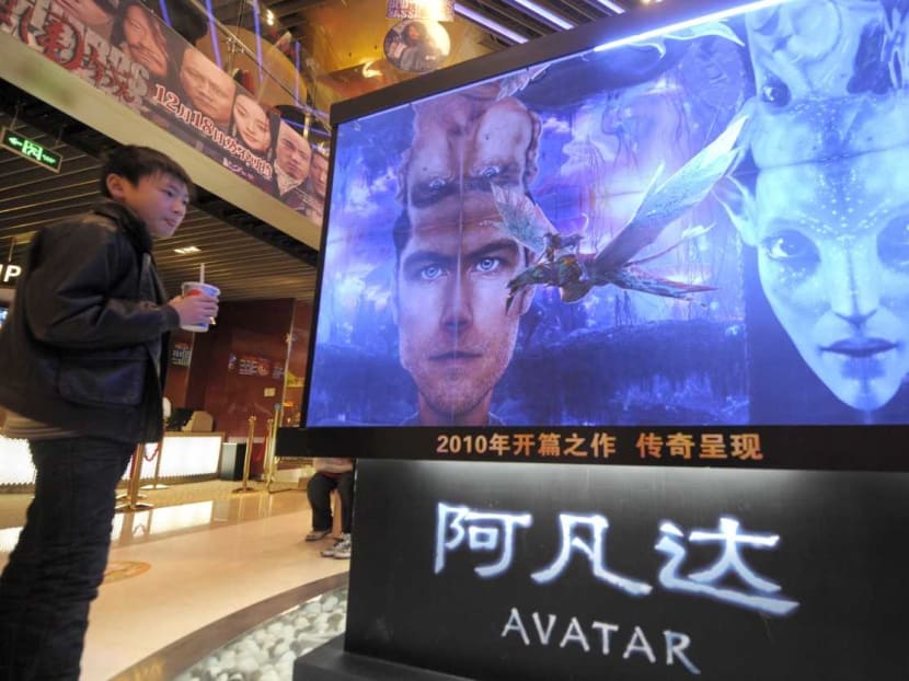 A boy looks at a poster for the movie Avatar at a cinema in Beijing. It is one of 140 science fiction movies watched by  researchers at the National University of Singapore in their study.