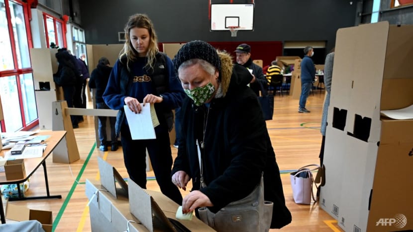 Australian voters head to polls in close-run election